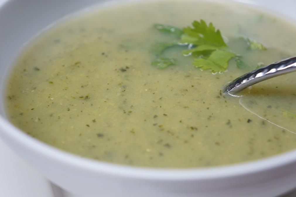 Creamy soup with cilantro garnish in bowl.